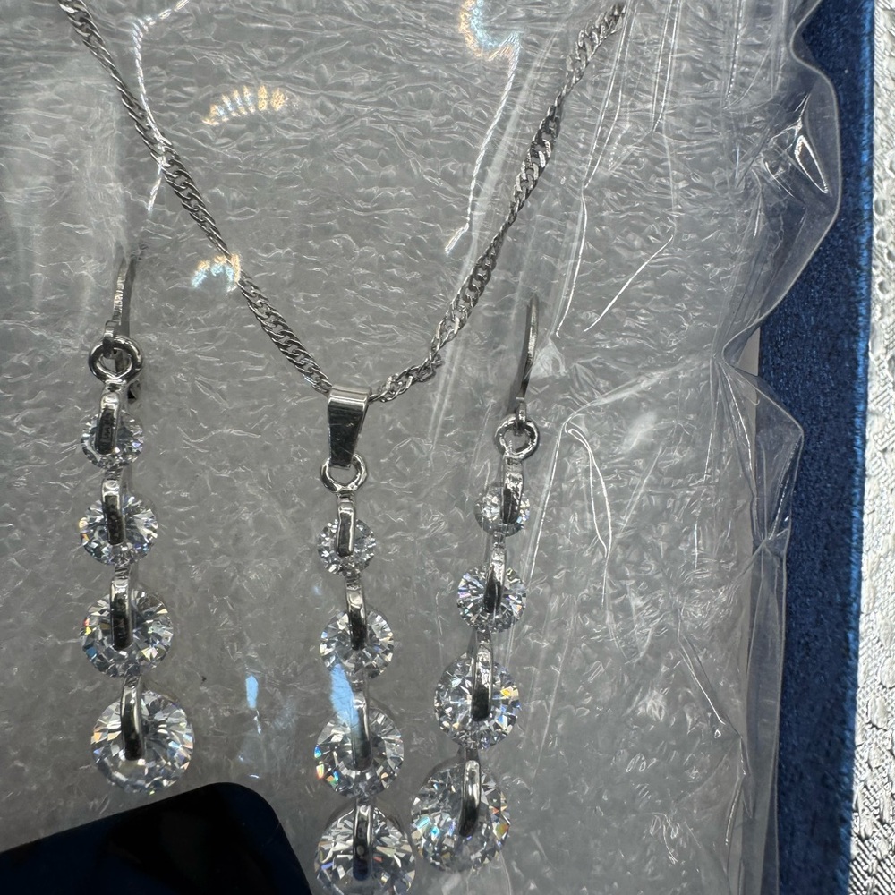 Cascading round cut earrings necklace set clear stones